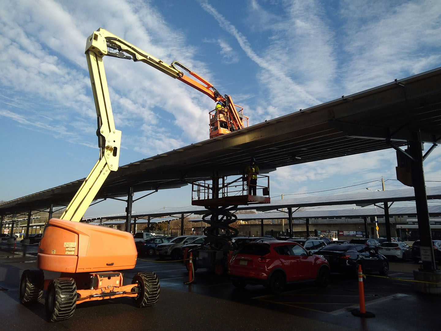 An aerial lift extending over an elevated train track.