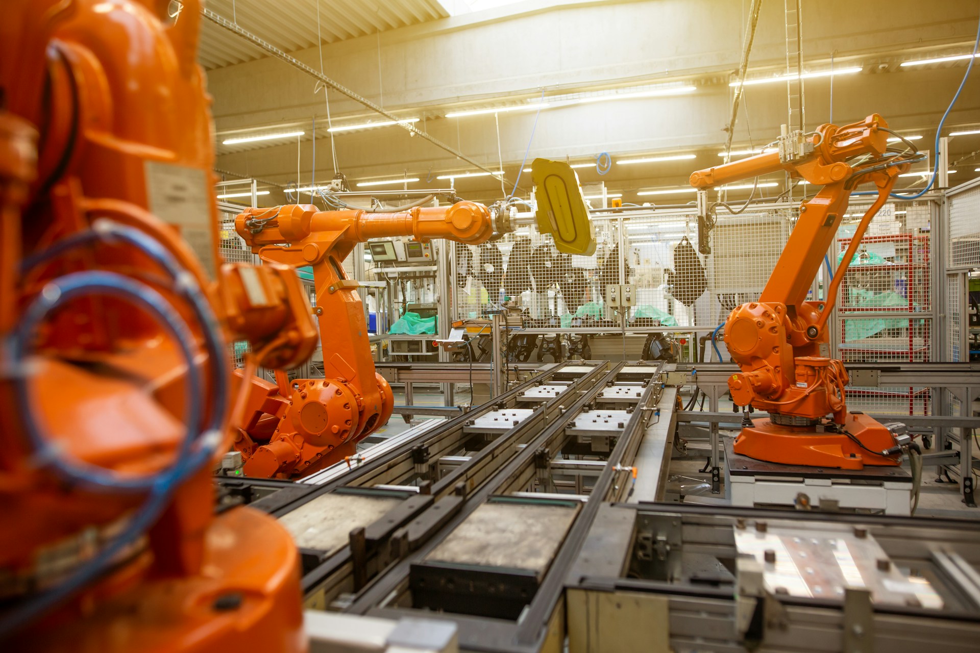 A factory with orange robotic machines.
