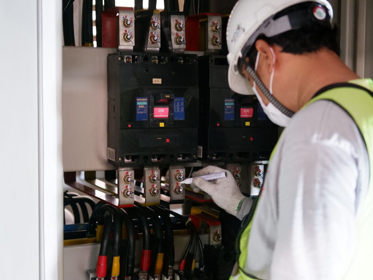 Man working on an electrical panel