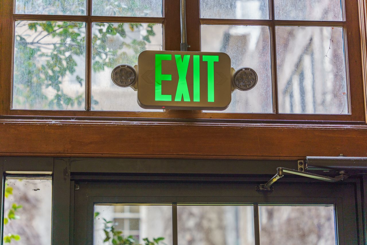 green exit sign in a building