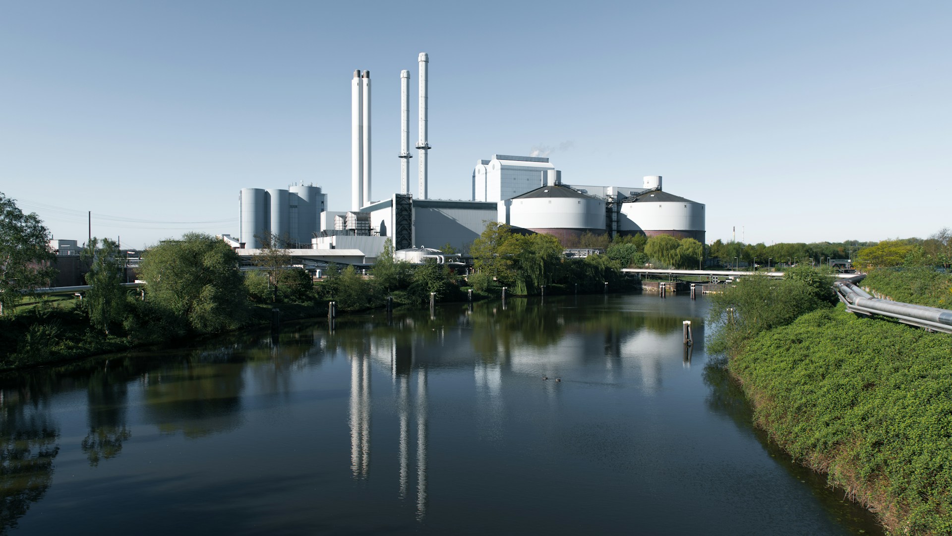 A factory next to a river.